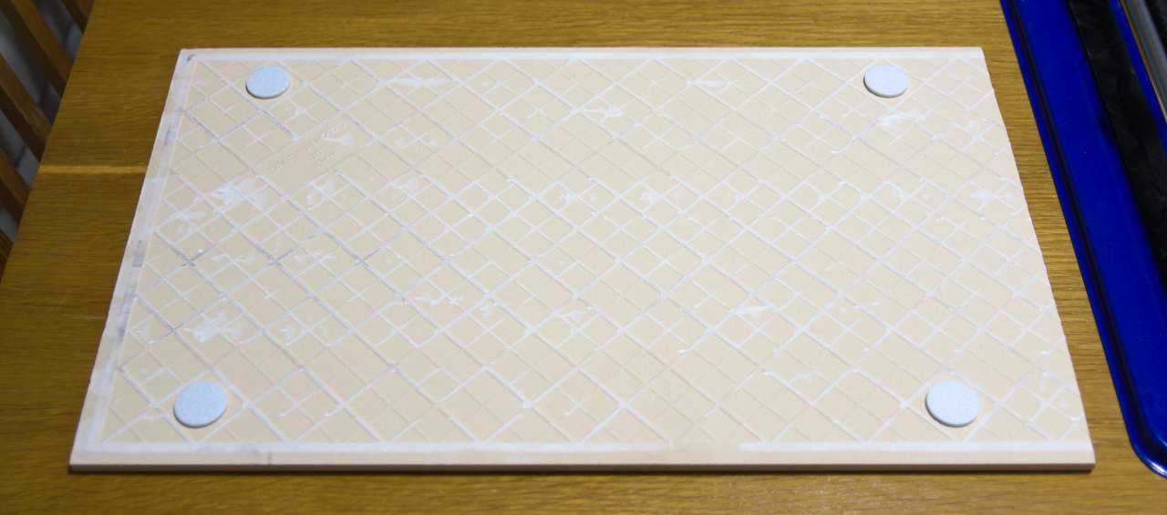 Cut tile on felt pads